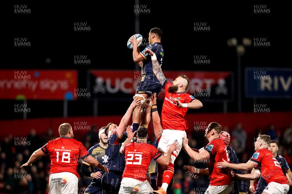 030323 - Munster v Scarlets - United Rugby Championship - Dan Davis of Scarlets takes possession in a line-out ahead of RG Snyman of Munster