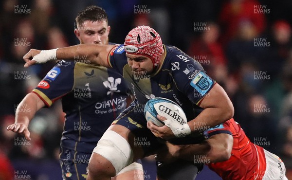 030323 - Munster v Scarlets - United Rugby Championship - Sione Kalamafoni of Scarlets is tackled by Malakai Fekitoa of Munster