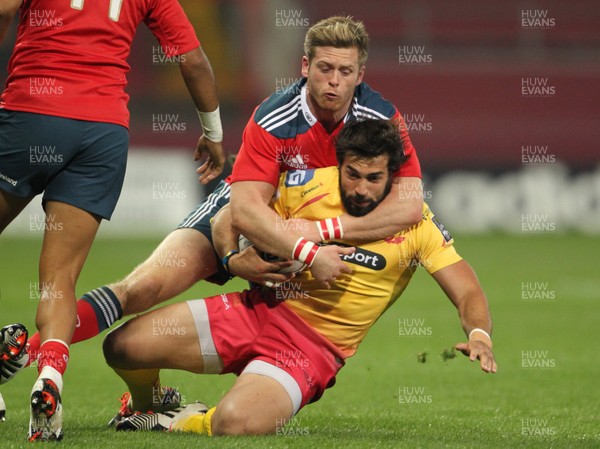 101014 - Munster v Scarlets - Guinness PRO12 -Gareth Owen is tackled to the ground by Ivan Dineen