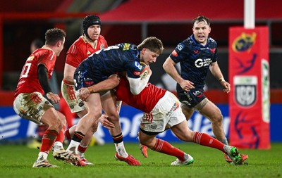 150225 - Munster v Scarlets - United Rugby Championship - Ellis Mee of Scarlets is tackled by Tom Farrell of Munster 