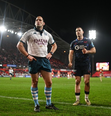 150225 - Munster v Scarlets - United Rugby Championship - Referee Federico Vedovelli with Gareth Davies of Scarlets