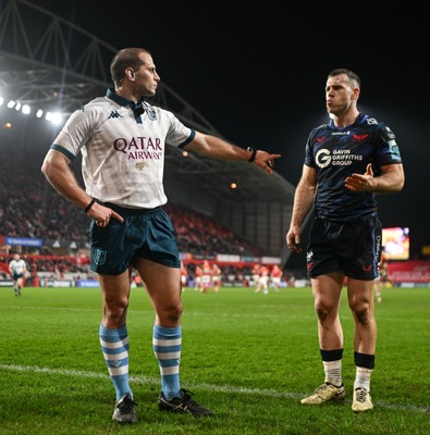 150225 - Munster v Scarlets - United Rugby Championship - Referee Federico Vedovelli with Gareth Davies of Scarlets