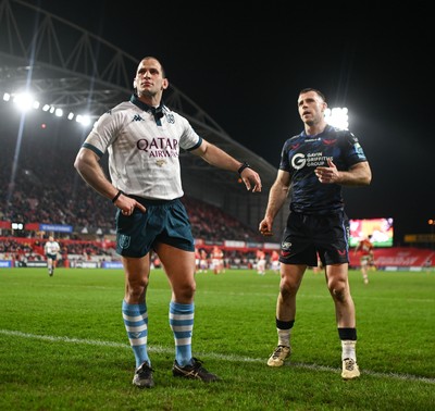 150225 - Munster v Scarlets - United Rugby Championship - Referee Federico Vedovelli with Gareth Davies of Scarlets