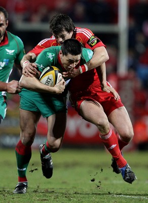 18.03.10 Munster v Scarlets... Munster's Ian Dowling tackles Regan King of Llanelli Scarlets. 