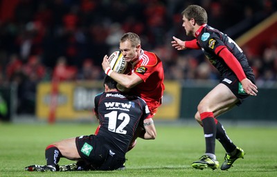 21.11.10 - Munster v Scarlets, Magners League Munster's Paul Warwick is tackled by Regan King of Scarlets 