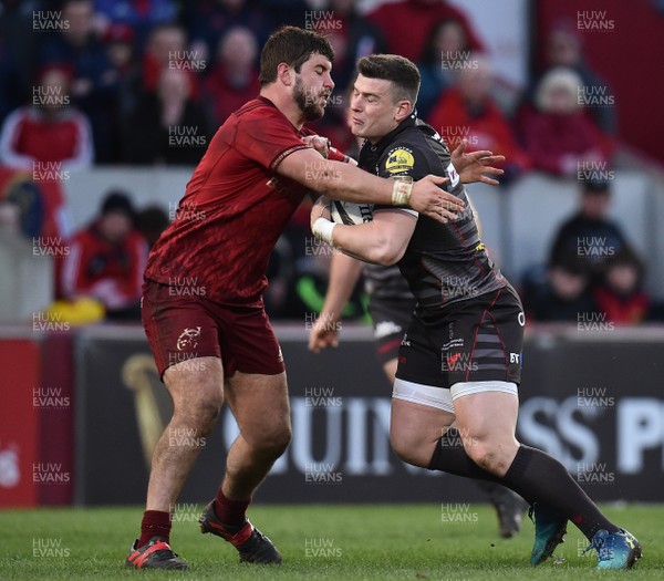 240318 - Munster v Scarlets - Guinness PRO14 -  Scott Williams of Scarlets is tackled by Rhys Marshall of Munster 