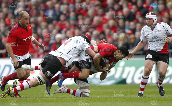 080412 Munster v Ulster - Heineken Cup - Lifeimi Mafi of Munster is tackled by Johann Muller and Paddy Wallace of Ulster 