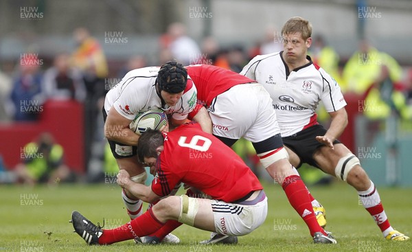 080412 Munster v Ulster - Heineken Cup - Stephen Ferris of Ulster is tackled by Peter O'Mahone and BJ Botha of Munster 