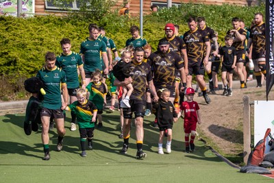 100525 - Nant Conwy v Bethesda - North Wales Division 1 Cup Final - Players enter the field with mascots ahead of kick off