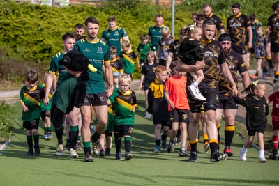 100525 - Nant Conwy v Bethesda - North Wales Division 1 Cup Final - Players enter the field with mascots ahead of kick off