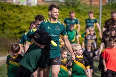 100525 - Nant Conwy v Bethesda - North Wales Division 1 Cup Final - Players enter the field with mascots ahead of kick off