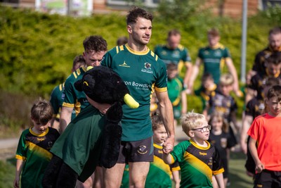 100525 - Nant Conwy v Bethesda - North Wales Division 1 Cup Final - Players enter the field with mascots ahead of kick off