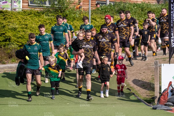 100525 - Nant Conwy v Bethesda - North Wales Division 1 Cup Final - Players enter the field with mascots ahead of kick off