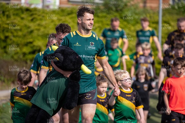 100525 - Nant Conwy v Bethesda - North Wales Division 1 Cup Final - Players enter the field with mascots ahead of kick off