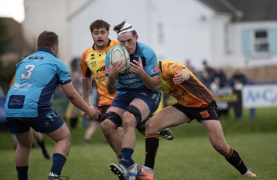 101026 - Narberth v Pontypridd - Admiral WRU Premiership - Narberth’s Caleb Salmon is tackled by Chad Davies