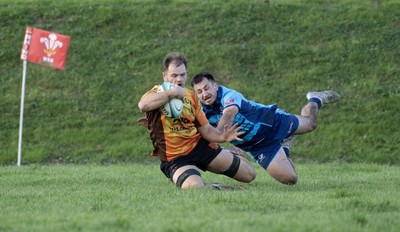 101026 - Narberth v Pontypridd - Admiral WRU Premiership - Pontypridd’s Cai James scores try despite a tackle by Lewys Gibby