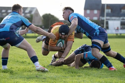 101026 - Narberth v Pontypridd - Admiral WRU Premiership - Pontypridd’s Joe Miles is tackled by Kieran Allen(rt) and Dean James (lt)