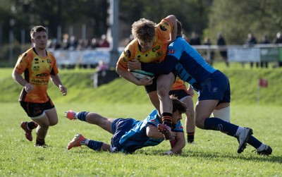 101026 - Narberth v Pontypridd - Admiral WRU Premiership - Pontypridd’s Ethan Williams is tackled by Harry Fuller (lt) and Jonathan Rogers (rt)