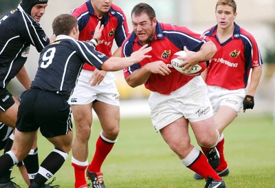 270903 - Neath-Swansea Ospreys v Munster - Celtic League - Munster's Simon Kerr takes on Andy Williams