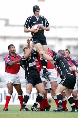 270903 - Neath-Swansea Ospreys v Munster - Celtic League - Ospreys' Luke Tait wins line out ball