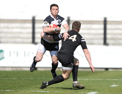 17.04.10 - Neath v Bedwas - Principality Premiership - Neath's Kristian Phillips is tackled by Dan Deardun. 