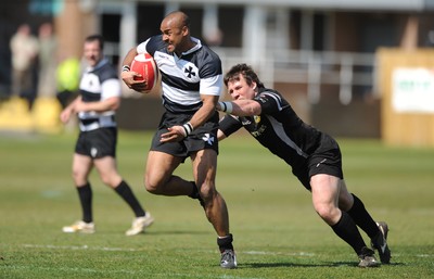 17.04.10 - Neath v Bedwas - Principality Premiership - Neath's Nathan Brew beats Kieron Crawford to score try. 