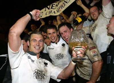 270405Neath v BedwasNeaths Gareth Morris celebrates with the team after being presented with the Premier League Trophy by David Pickering