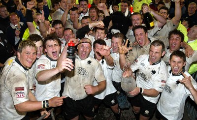 270405Neath v BedwasNeaths Gareth Morris celebrates with the team after being presented with the Premier League Trophy by David Pickering