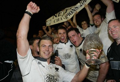 270405Neath v BedwasNeaths Gareth Morris celebrates with the team after being presented with the Premier League Trophy by David Pickering