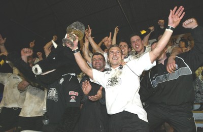 270405Neath v BedwasNeaths Gareth Morris celebrates with the team after being presented with the Premier League Trophy by David Pickering