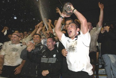 270405Neath v BedwasNeaths Gareth Morris celebrates with the team after being presented with the Premier League Trophy by David Pickering