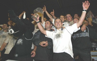 270405Neath v BedwasNeaths Gareth Morris celebrates with the team after being presented with the Premier League Trophy by David Pickering