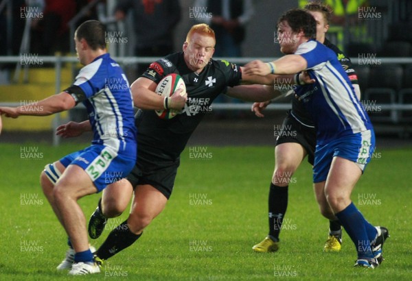 300813 Neath RFC v Bridgend RFC - British and Irish Cup Qualifier -Neath's Steffan Jones takes on Bridgend's Adam Hillier Rees