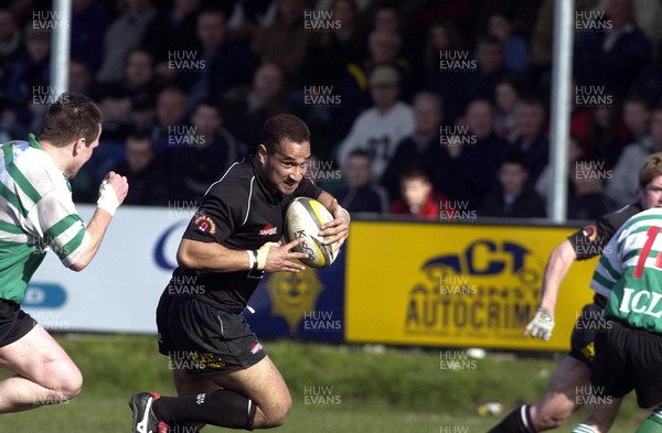 150303 - Neath v Caerphilly - Welsh Premiership - Dave Tieuti races in to touch down a first half try despite the best efforts of Caerphilly's Roddy Boobyer