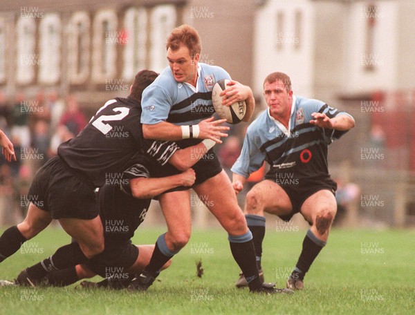 091196 - Neath v Cardiff - Mike Hall of Cardiff is tackled by David Hawkins and Ian Boobyer