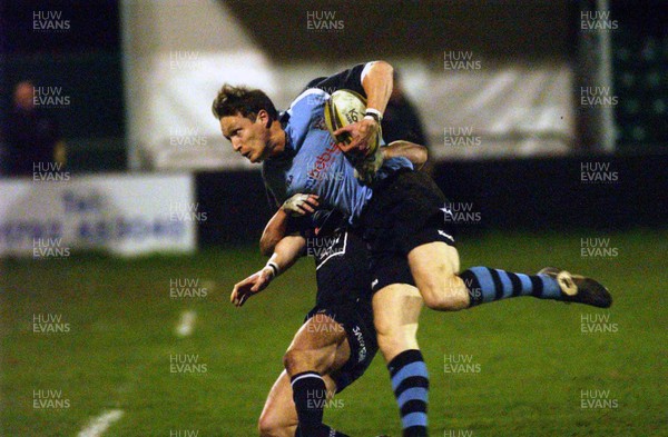 120303 - Neath v Cardiff - Welsh Premiership - Cardiff's Nick Walne is tackled by Shane Williams