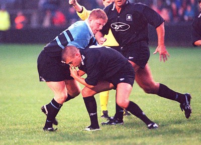 230897 - Neath v Cardiff - Patrick Horgan is tackled by Gwyn Jones