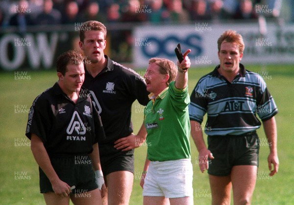 231093 - Neath v Cardiff - Ian Boobyer is sent off by Clayton Thomas as captains Gareth Llewellyn and Mike Hall watch