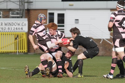 250212 - Neath v Cardiff - Welsh Premiership - Rhys Patchell of Cardiff is tackled by David Langdon of Neath