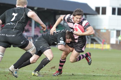 250212 - Neath v Cardiff - Welsh Premiership - Alex Walker of Cardiff is tackled by David Langdon of Neath