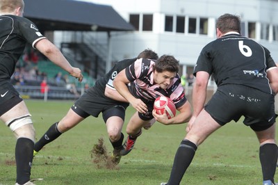 250212 - Neath v Cardiff - Welsh Premiership - Alex Walker of Cardiff is tackled by David Langdon of Neath