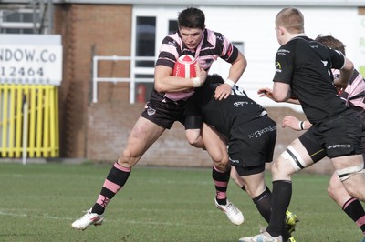 250212 - Neath v Cardiff - Welsh Premiership - Richard Smith of Cardiff is tackled by David Langdon of Neath