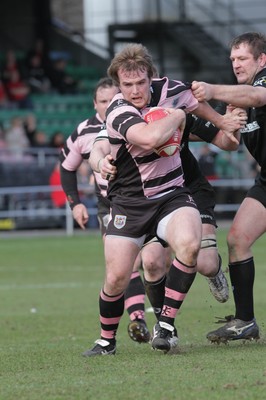 250212 - Neath v Cardiff - Welsh Premiership - Kristian Dacey of Cardiff slips a tackle