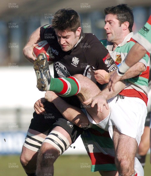 250206 - Neath RFC v Ebbw Vale RFC - Principality Permiership - The Gnoll - Neath's Dan McShane is tackled by Andrew Bevan 