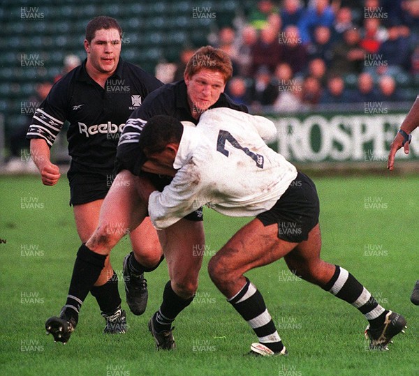 251095 - Neath RFC v Fiji - Chris Scott of Neath is tackled by Emori Katalau