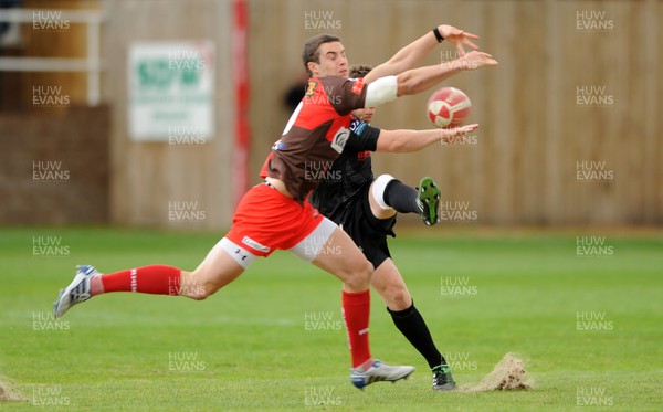 12.05.11 - Neath v Llanelli - Principality Premiership Play-Off - Steve Shingler of Llanelli charges down Dai Langdon of Neath's kick to score try. 