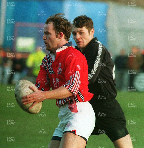 201193 - Neath v Llanelli - Ian Wyn of Llanelli is challenged by Allan Harries of Neath