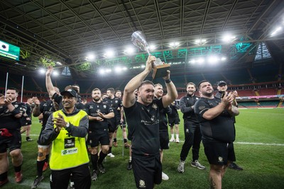 120426 - Neath v Merthyr - Mens Premiership Cup Final - Ben Williams lifts the trophy with his Neath team mates