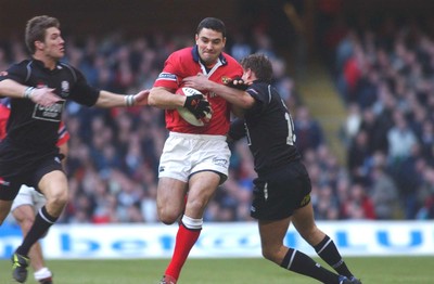 010203 - Neath v Munster - Celtic League Final -  Munster's Jeremy Staunton is tackled by James Storey (lt) and Adrian Durston