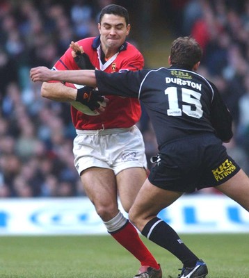 010203 - Neath v Munster - Celtic League Final - Munster's Jeremy Staunton is tackled by Adrian Durston